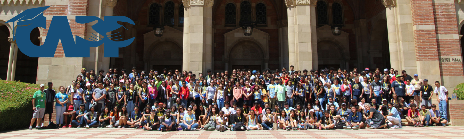 Large group photo of students in front of a campus administrative building and the CAPP logo overlay