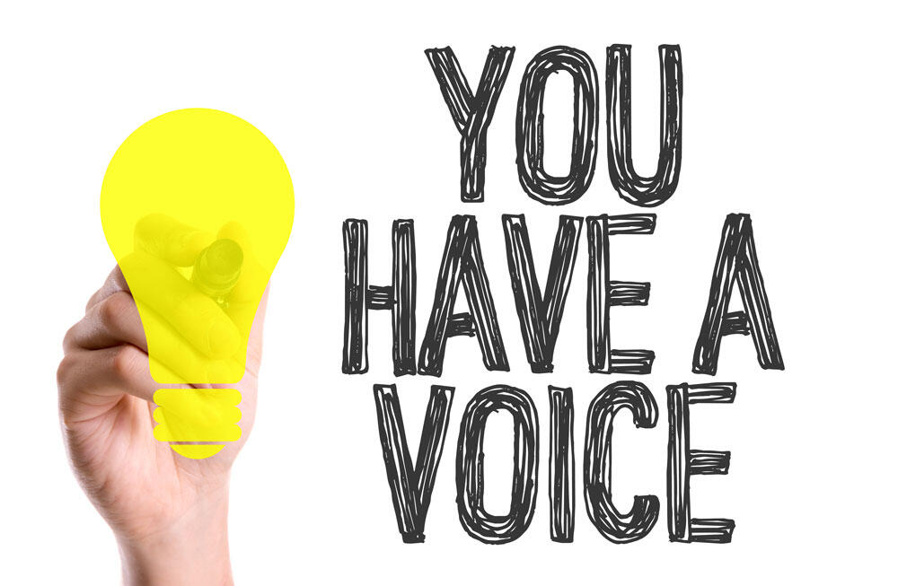 Hand holding lightbulb with text You Have a Voice